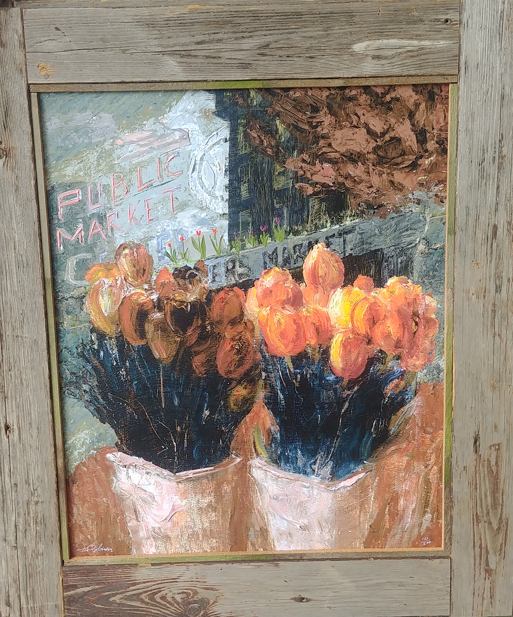 A painting of tulips below the Pike Place Market sign